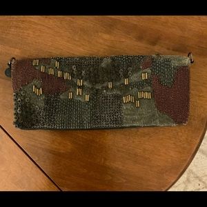 Hand embellished black leather clutch